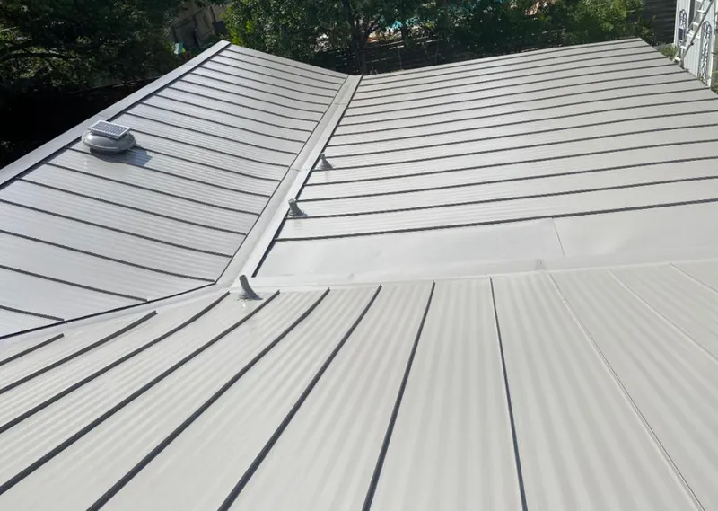 Solar attic fan installed on a metal roof for Roof Ventilation in Cypress Gardens